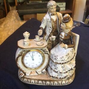 Vintage porcelain gentleman and lady table clock